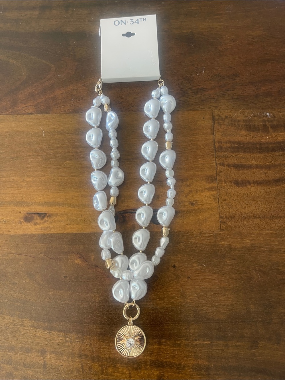 ON:34TH White Pearl Bead Necklace with Gold Sunburst Pendant